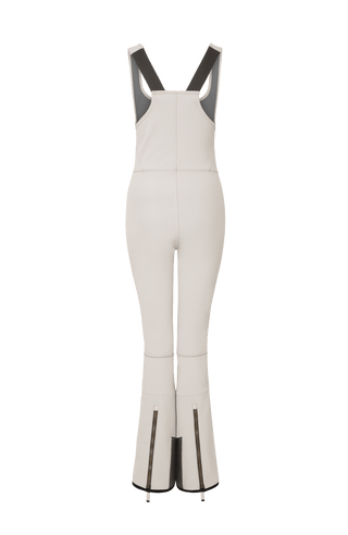 Ski-Catsuit Davina2.0-S im Latzhosen-Stil ohne Ärmel, schmaler figurbetonter Schnitt mit ausgestelltem Bein, femininer Bustier-Ausschnitt, Streifen an den Beinaußenseiten aus Alcantara-Leder, Träger hinten aus elastischem Gummi, ergonomisches Knie, markanter langer Zipper, auffallende Nähte, Seitentaschen mit Zip, Kantenschutz aus Alcantara-Leder und Schneefang. Enganliegend, feminin, betont Silhouette und Bewegungsfreiheit. In der Farbe Weiß-Beige (Farbe: sandstone)